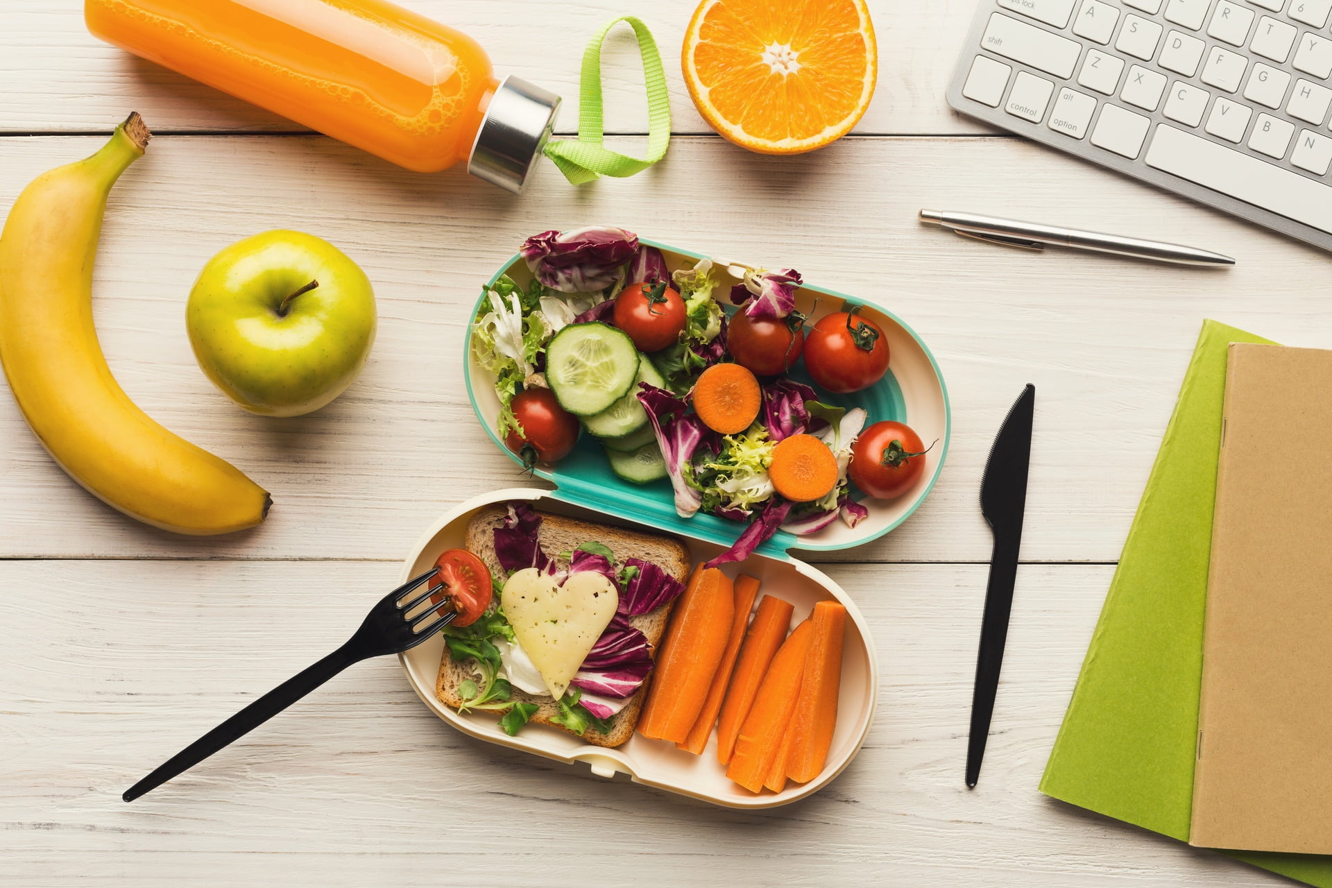 Healthy dinner from lunch box at office working table 